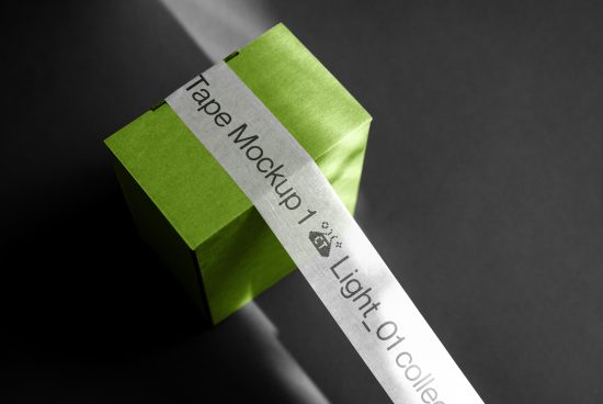 Green box with silver tape mockup on dark background, ideal for branding presentations and design assets.